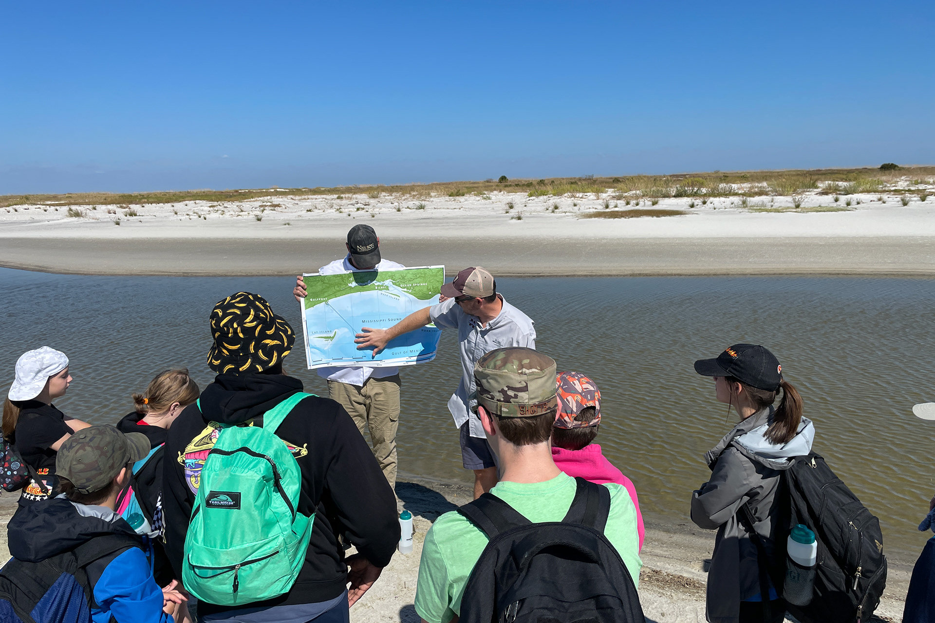 Middle and high school students on the Ship Island coastline during the 2022 MSU-SEAS Program